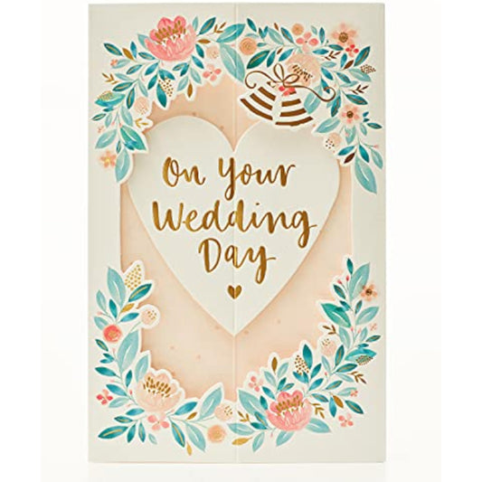 3D pop-up floral wedding heart greeting card from UK Greetings with intricate floral design and romantic heart shape.