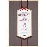 Luxury red ribbon 40th Ruby Anniversary husband greeting card by UK Greetings, featuring elegant design and heartfelt message.