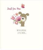 Greeting card featuring a colorful illustration of a pet grooming station with dogs, by UK Greetings.