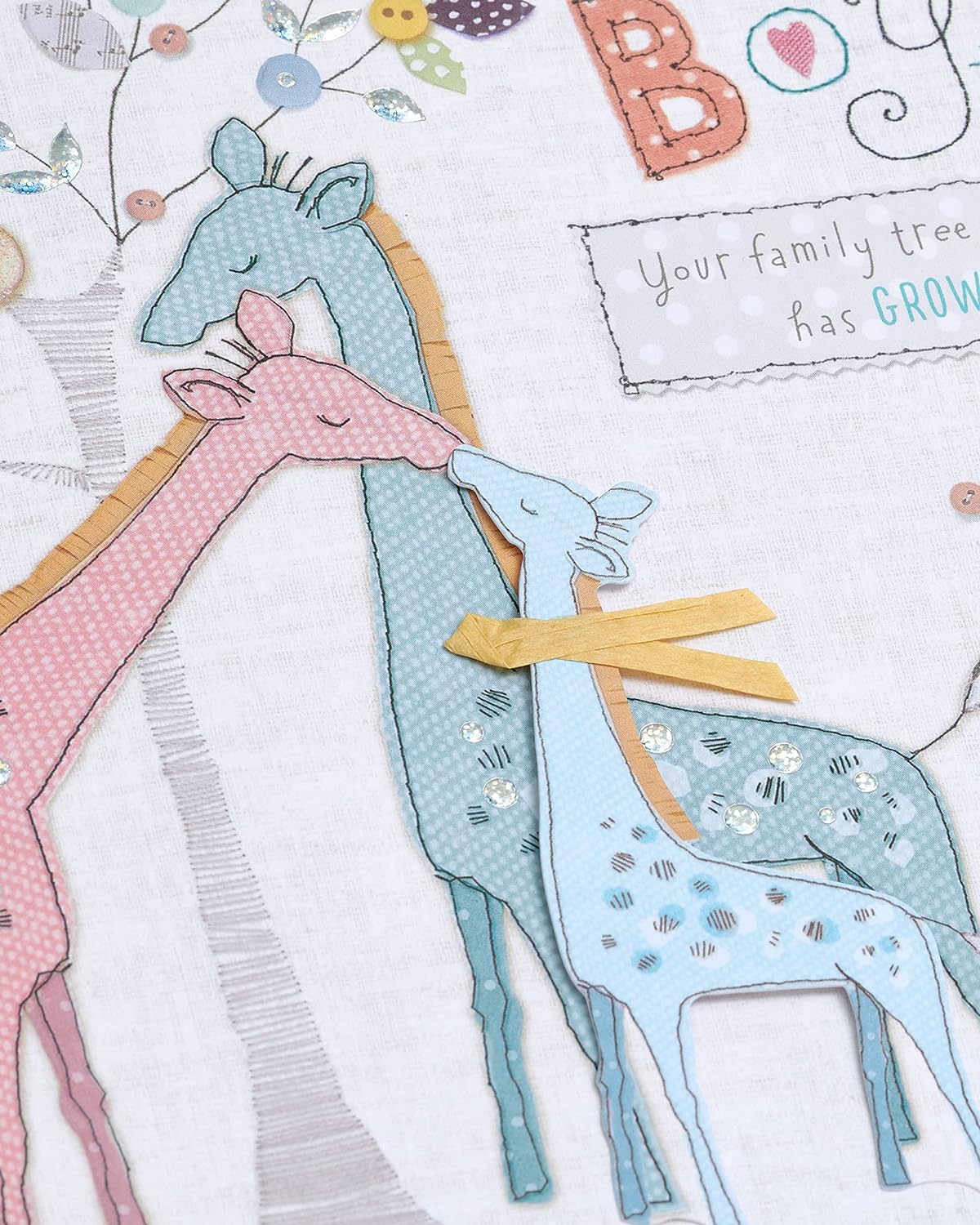 Cute giraffe greeting card for new baby boy by UK Greetings, featuring adorable animal illustration and cheerful design.