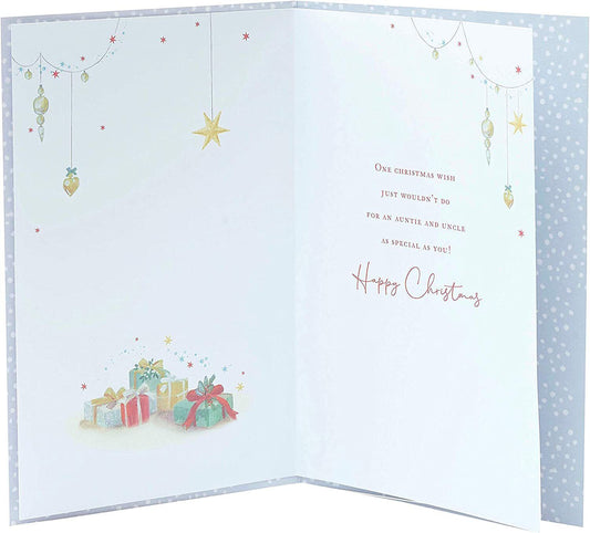 A UK Greetings Christmas greeting card featuring a traditional Christmas tree with elegant gold foil accents.