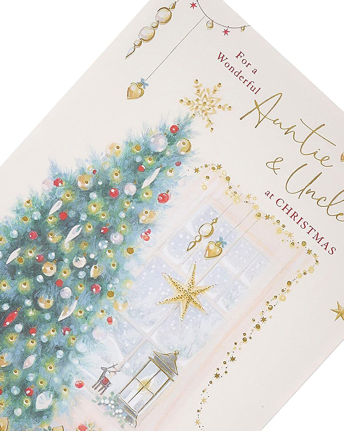 Christmas greeting card featuring a traditional Christmas tree with elegant gold foil design, by UK Greetings.