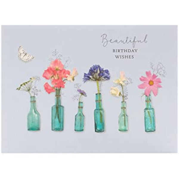 Beautiful birthday wishes floral greeting card by UK Greetings featuring colorful flower illustrations on the front.