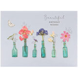 Beautiful birthday wishes floral greeting card by UK Greetings featuring colorful flower illustrations on the front.