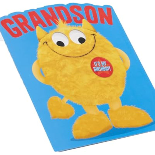 Bright birthday greeting card for grandson featuring a googly-eyed monster design from UK Greetings.