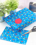 Blue Stars wrapping paper with three sheets and two gift tags, perfect for gift wrapping and greeting card presentation.