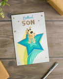 Greeting card featuring Boofle standing on a star with "Brilliant Son" birthday message, UK Greetings product image.