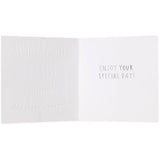 UK Greetings Cake Niece birthday greeting card with colorful cake illustration and special day message inside.