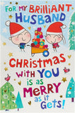 Cartoon couple Christmas greeting card with festive holiday design by UK Greetings, featuring fun and loving holiday imagery.