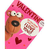 Colorful cartoon pop-up Valentine's Day greeting card with heart designs, from UK Greetings, featuring cheerful illustrations and festive detail.