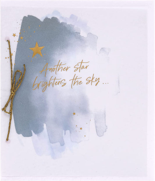 Gold star sympathy greeting card with celestial design from UK Greetings, featuring a heartfelt message for condolence and comfort.