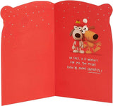 Humorous Christmas greeting card featuring crackers and a brother illustration with festive red foil accents, by UK Greetings.