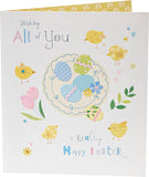 Cute Easter greeting card from UK Greetings featuring colorful Easter eggs and spring floral designs on the front.