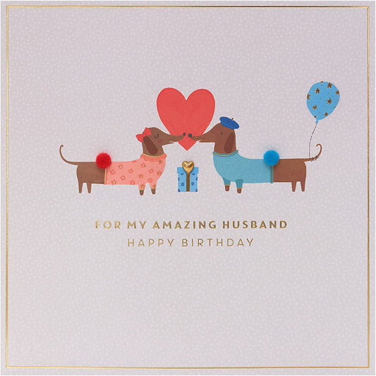 Cute sausage dog husband birthday greeting card featuring a playful cartoon design from UK Greetings.