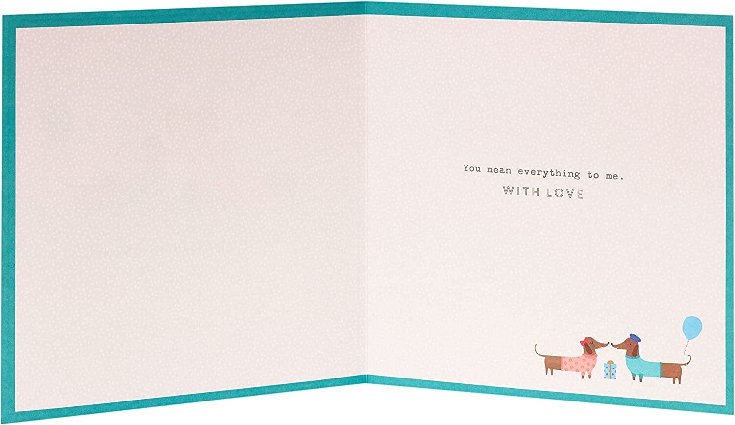 Cute sausage dog husband birthday greeting card from UK Greetings, featuring adorable dog illustration on a cheerful card.