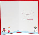 Christmas greeting card featuring festive characters and a Christmas tree design from UK Greetings, perfect for holiday wishes.