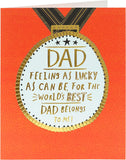 Gold medal-themed Father's Day greeting card from UK Greetings featuring a celebratory design and heartfelt message.