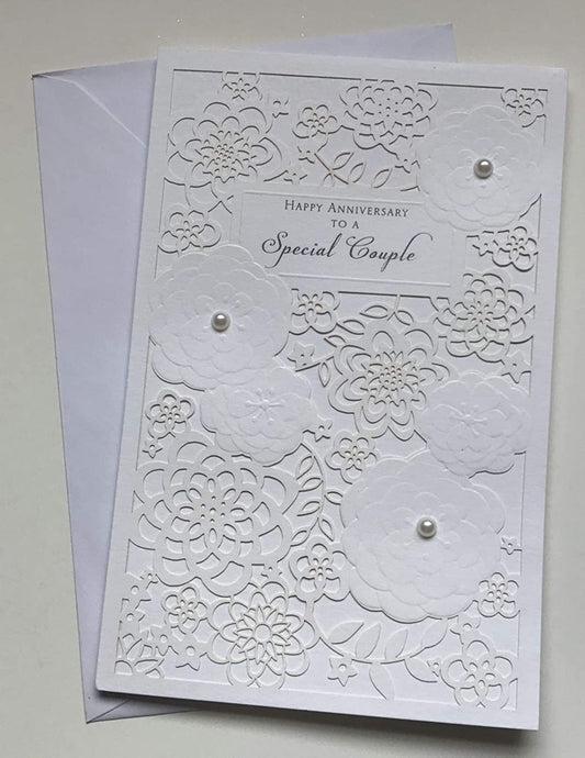 Elegant die-cut pearls anniversary greeting card from UK Greetings featuring a luxurious design for couples.