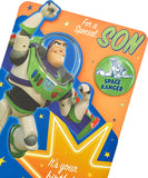 Disney Toy Story Buzz Lightyear birthday greeting card with badge from UK Greetings, featuring Buzz Lightyear in a playful pose.