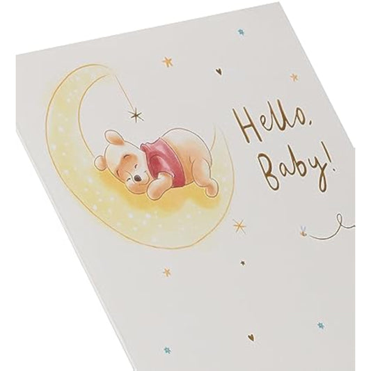 Disney Winnie the Pooh new baby greeting card with gold foil accents, UK Greetings, featuring a cheerful baby-themed illustration.