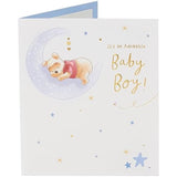 Disney Winnie the Pooh new baby boy greeting card by UK Greetings featuring Pooh Bear and a cheerful design.