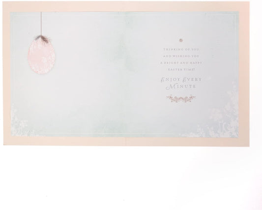 Easter greeting card from UK Greetings with floral design and "Easter Wishes with Love" message on the front.