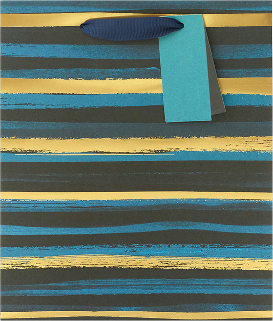 Elegant blue and gold striped gift bag with greeting card from UK Greetings, featuring decorative design and festive style.