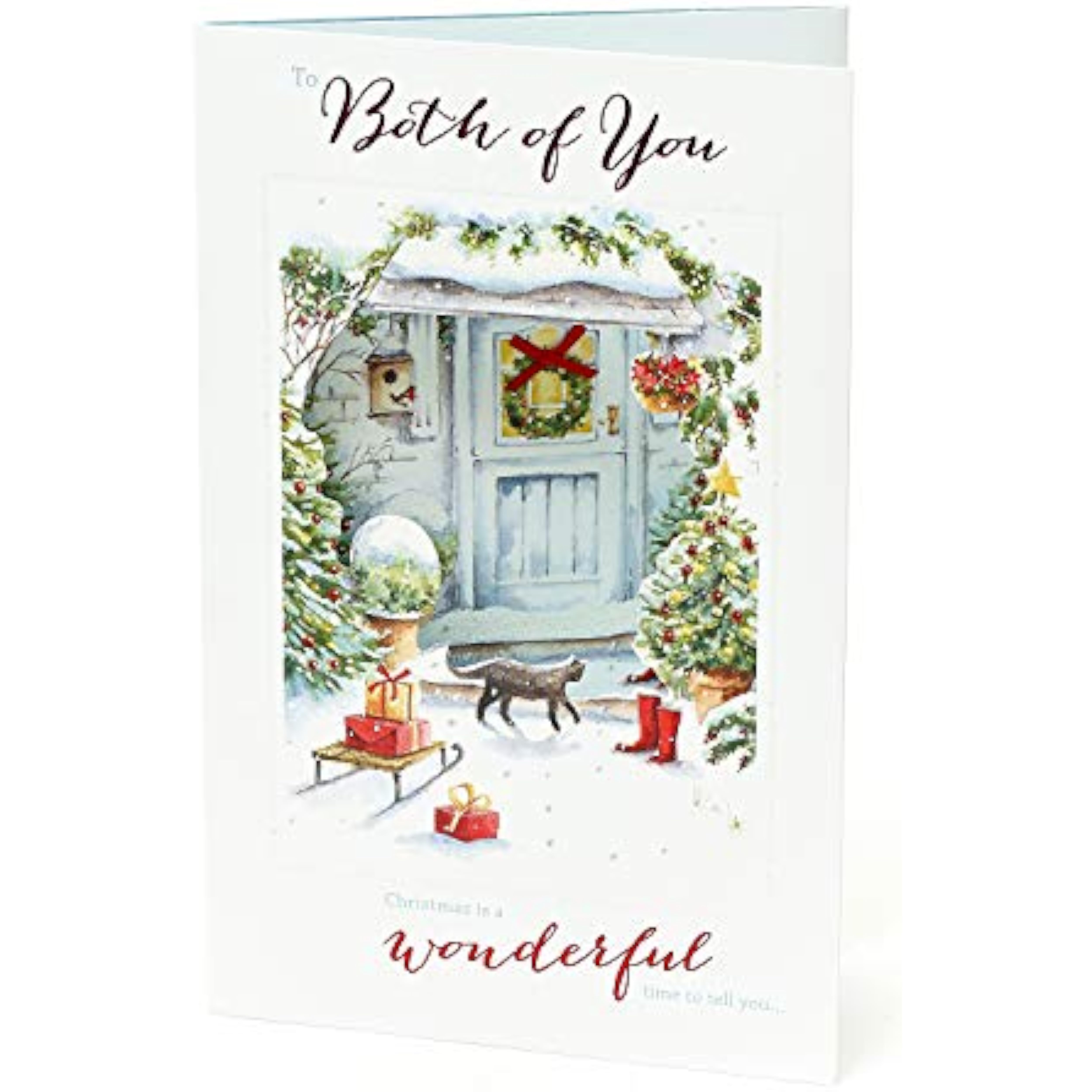 Elegant UK Greetings Christmas greeting card for a couple with glitter accents and a decorative bow, featuring festive holiday design.