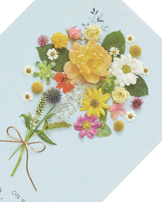 Elegant floral posy birthday greeting card with metallic shine from UK Greetings, featuring colorful flower illustrations on the front.