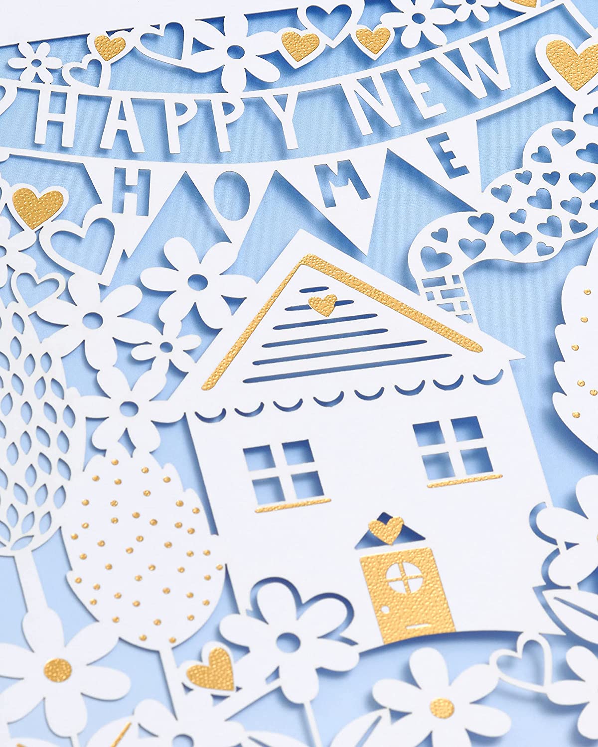 Elegant laser cut New Home Congratulations greeting card by UK Greetings featuring intricate designs and heartfelt message.