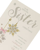 Elegant Stars Christmas greeting card for sister from UK Greetings, featuring festive star designs on the front.