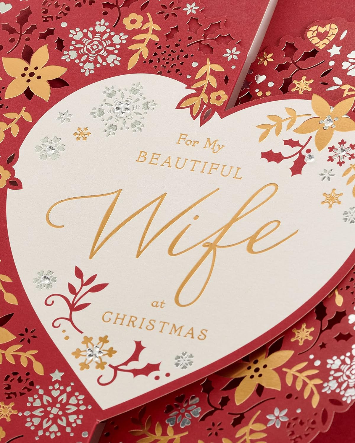 UK Greetings Christmas greeting card with love hearts and floral design, perfect for a wife during the holiday season.