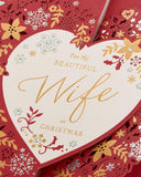 UK Greetings Christmas greeting card with love hearts and floral design, perfect for a wife during the holiday season.