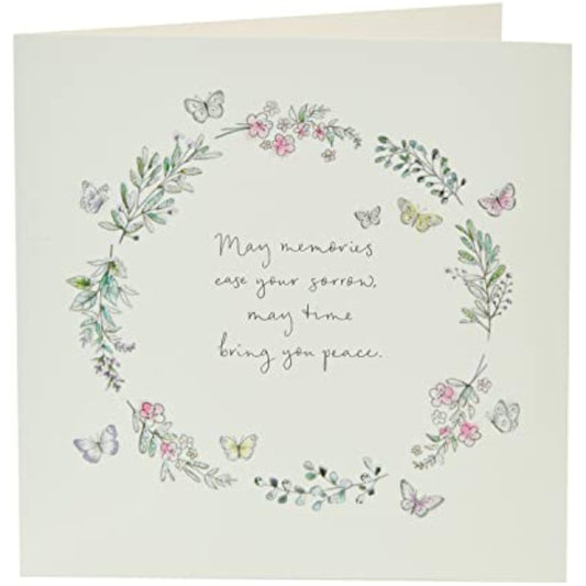 Floral butterfly sympathy greeting card from UK Greetings, featuring soft floral and butterfly illustrations on the front.