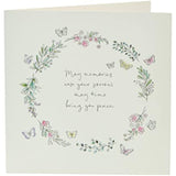 Floral butterfly sympathy greeting card from UK Greetings, featuring soft floral and butterfly illustrations on the front.