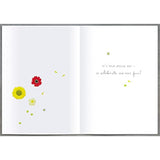 Floral cake design birthday wishes greeting card featuring meadow flowers from UK Greetings.