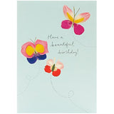Flower petal butterflies on a Meadow Range birthday greeting card by UK Greetings, featuring colorful floral and butterfly illustrations.