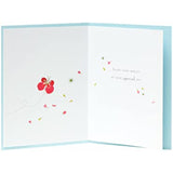 Flower petal butterflies on the Meadow Range birthday greeting card by UK Greetings, featuring colorful floral and butterfly illustrations.