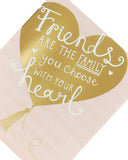 Pink and gold Friends Are Family birthday greeting card by UK Greetings showing a heartfelt design with floral accents.