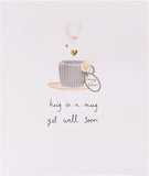 Handmade Get Well Soon greeting card featuring a cozy mug with a hug design from UK Greetings.