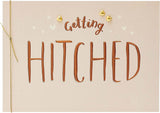 Getting Hitched Knot Love greeting card by UK Greetings featuring a romantic design with intertwined rings and heartfelt message.