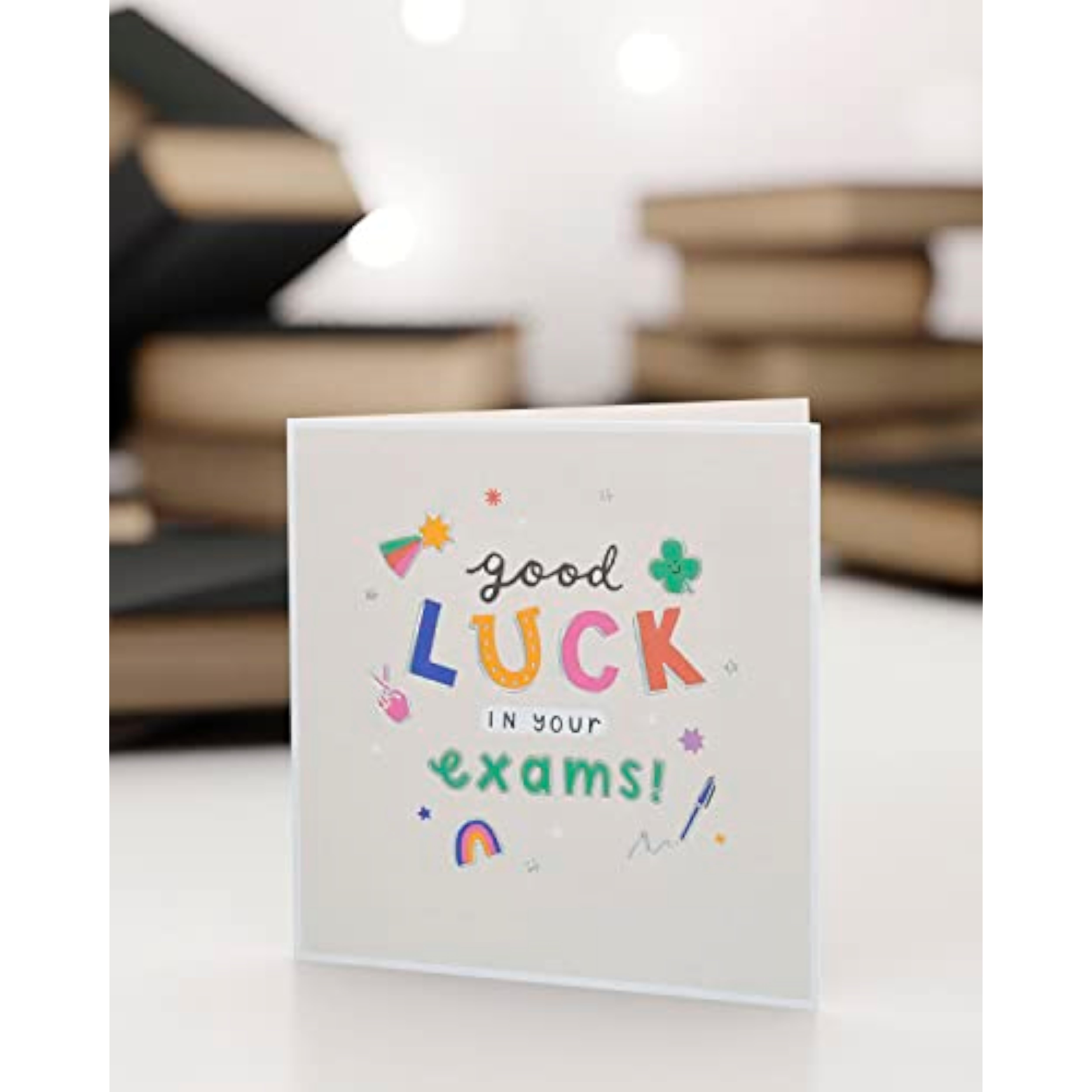 UK Greetings Good Luck Exams greeting card featuring colorful design and encouraging message for students.