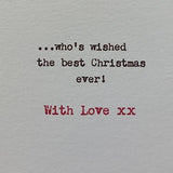 Festive greeting card featuring a cute dog with "Grandpa Lots of Woof" Christmas message, UK Greetings holiday design
