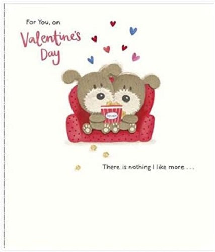 Cute couple on sofa greeting card with red foil finish, perfect for Valentine's Day from UK Greetings, featuring a Woof design.