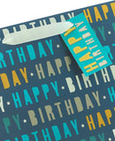 Large blue Happy Birthday gift bag with greeting card design from UK Greetings, featuring colorful birthday-themed illustrations.