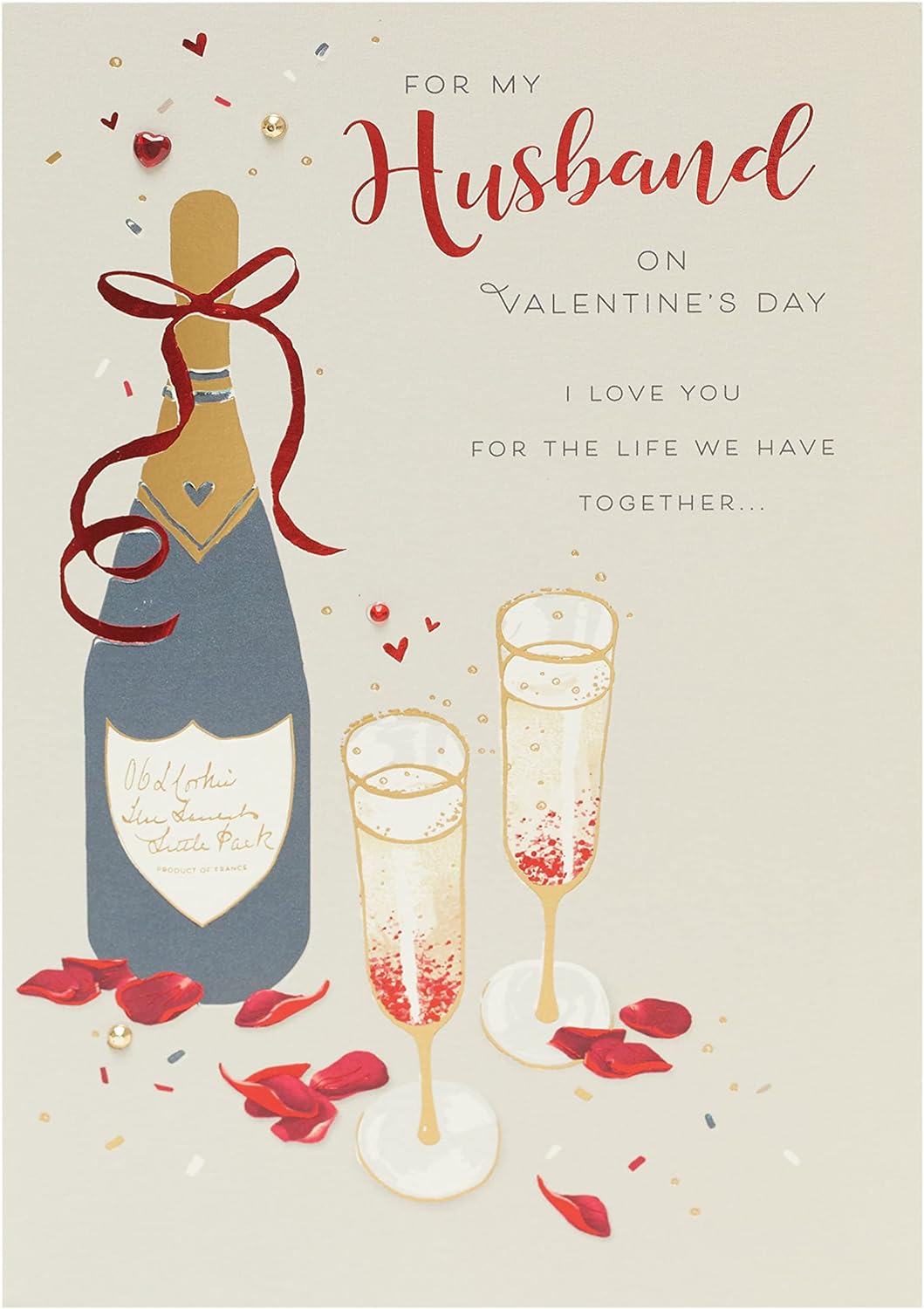 Husband Valentine's Day greeting card with champagne design and envelope from UK Greetings, featuring elegant floral and champagne illustrations.
