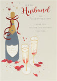 Husband Valentine's Day greeting card with champagne design and envelope from UK Greetings, featuring elegant floral and champagne illustrations.