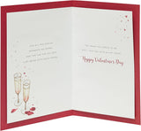 Champagne-themed husband Valentine's Day greeting card with envelope from UK Greetings, featuring elegant champagne glass design.