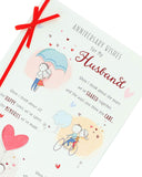 Red ribbon love wedding anniversary greeting card from UK Greetings, featuring romantic design and heartfelt message.