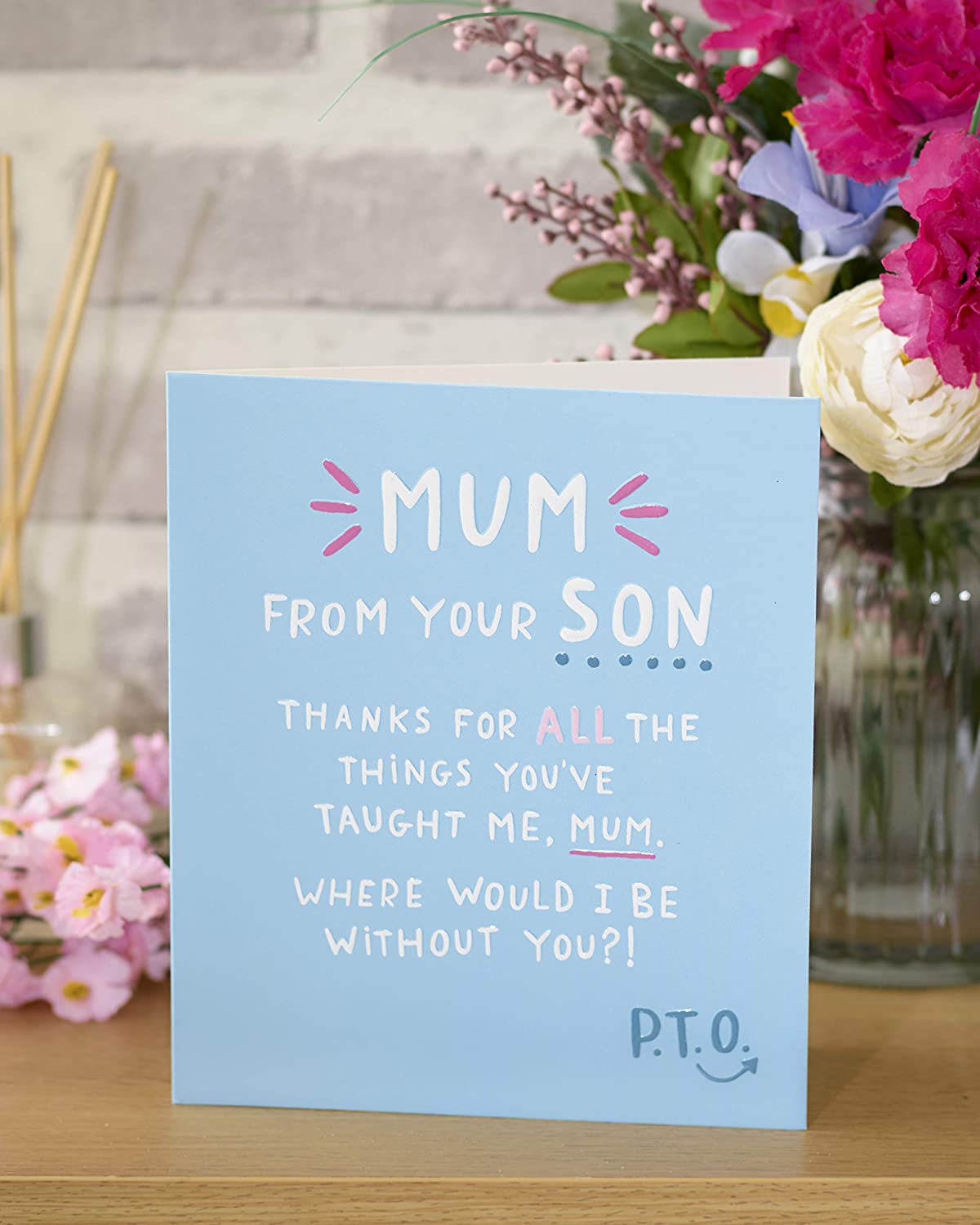 UK Greetings integrated mum from son greeting card with heartfelt message, featuring a colorful, artistic design.